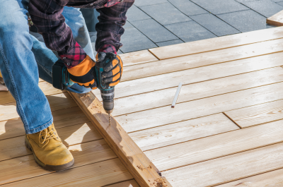 Handyman repairing a porch.