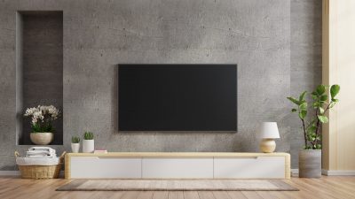 TV mounting on a wall above the entertainment center.